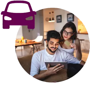 smiling couple looking at tablet