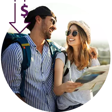 traveling couple with map smiling at each other