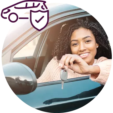 smiling woman in car holding car key